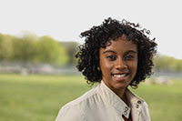 girl outside smiling for camera